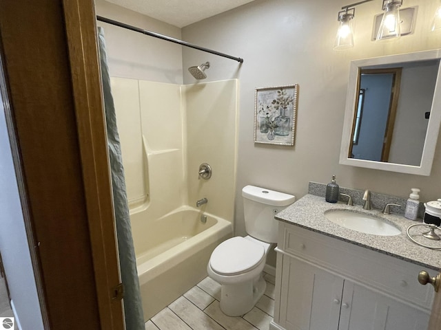 bathroom featuring vanity, toilet, and bathing tub / shower combination