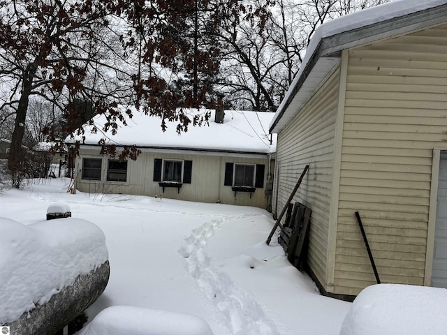 view of snow covered house