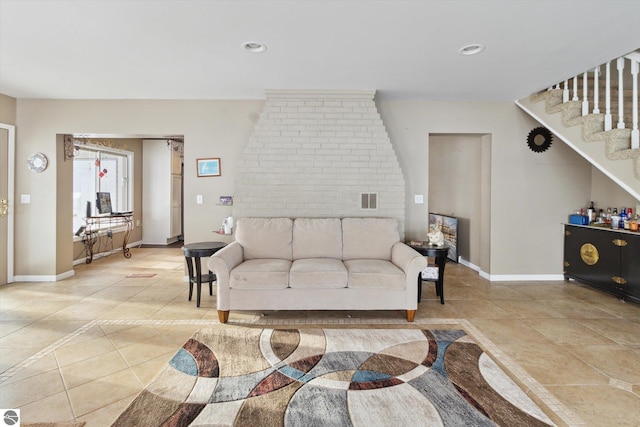 living room featuring stairway, baseboards, visible vents, and recessed lighting