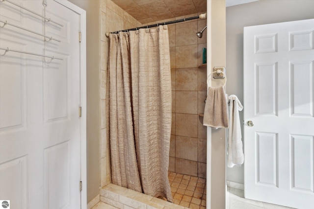 full bathroom with a shower stall