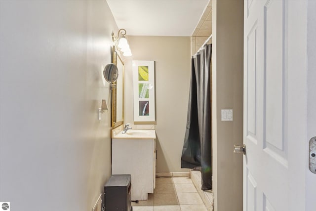 bathroom featuring a shower with shower curtain, tile patterned flooring, and vanity