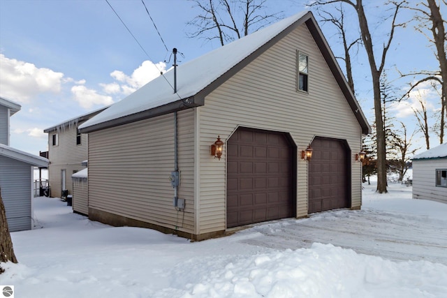 view of snow covered garage