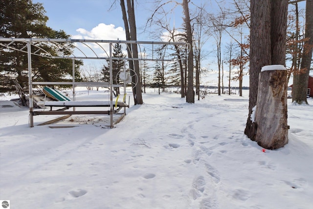 view of yard layered in snow