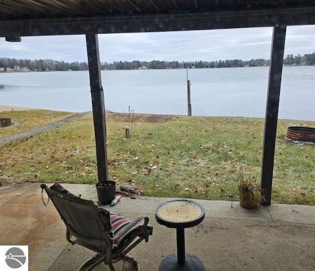 view of patio with a water view