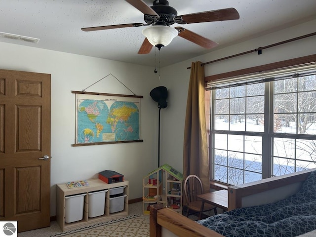 bedroom with visible vents and a ceiling fan