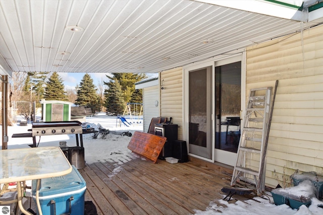 view of snow covered deck