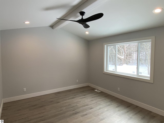 unfurnished room featuring baseboards, wood finished floors, and recessed lighting