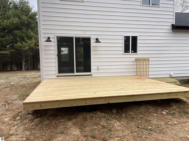 10402 Western Rd Unit 1, Rapid City, MI 49676 - view of wooden terrace