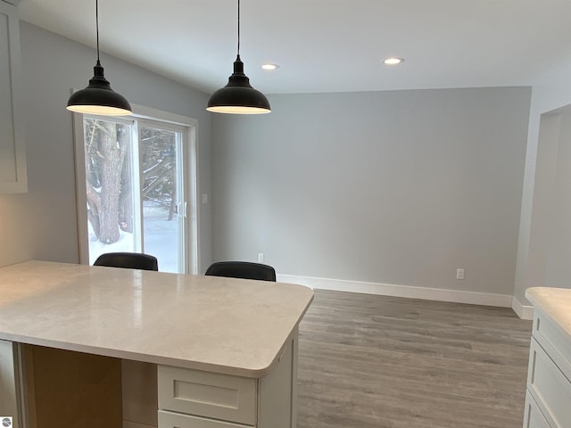 office area with recessed lighting, wood finished floors, and baseboards