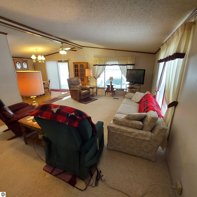 carpeted living area with ornamental molding, a notable chandelier, vaulted ceiling, and a textured ceiling