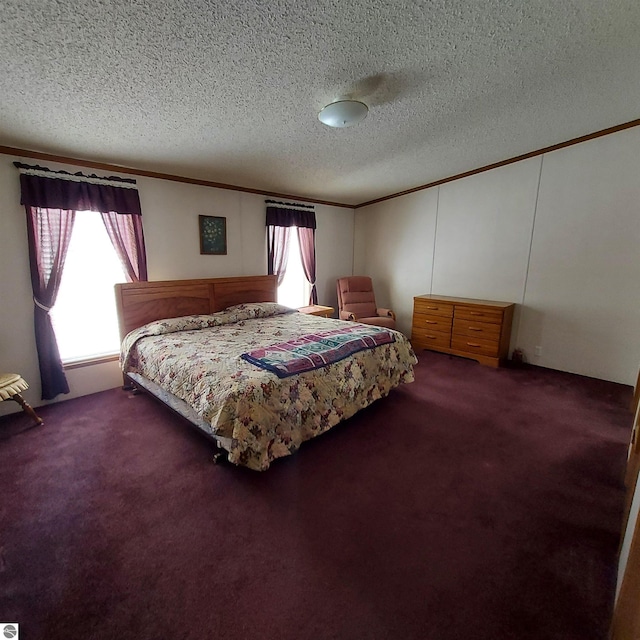 bedroom featuring crown molding, dark carpet, and a textured ceiling