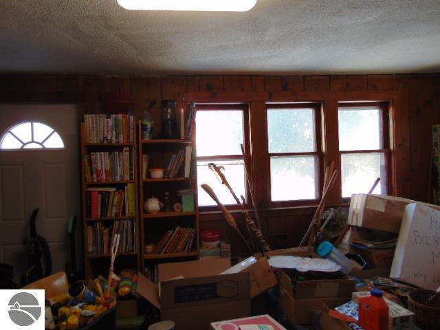 misc room featuring a textured ceiling and a wealth of natural light