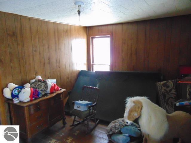 interior space featuring wooden walls