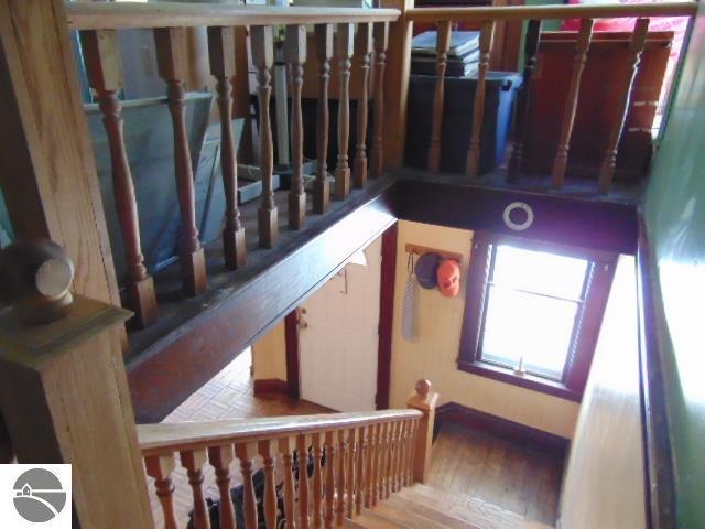 staircase featuring wood finished floors