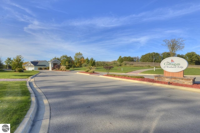 view of street featuring curbs and sidewalks