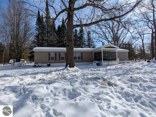 view of front of house featuring a sunroom