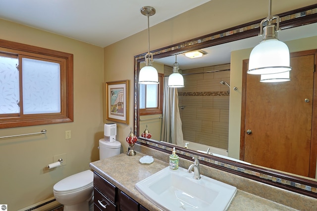 bathroom featuring a baseboard heating unit, vanity, and toilet