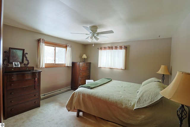 bedroom with light carpet, ceiling fan, and baseboard heating