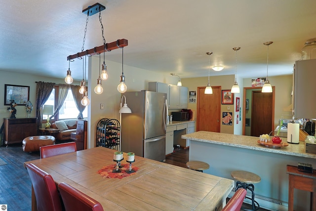 dining area featuring dark wood finished floors