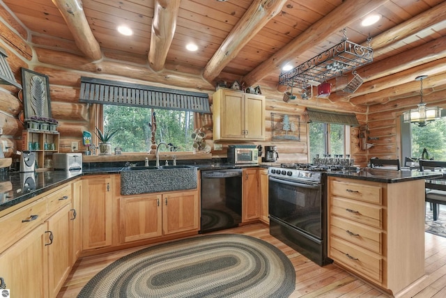 kitchen with a peninsula, a sink, black dishwasher, range with gas cooktop, and decorative light fixtures