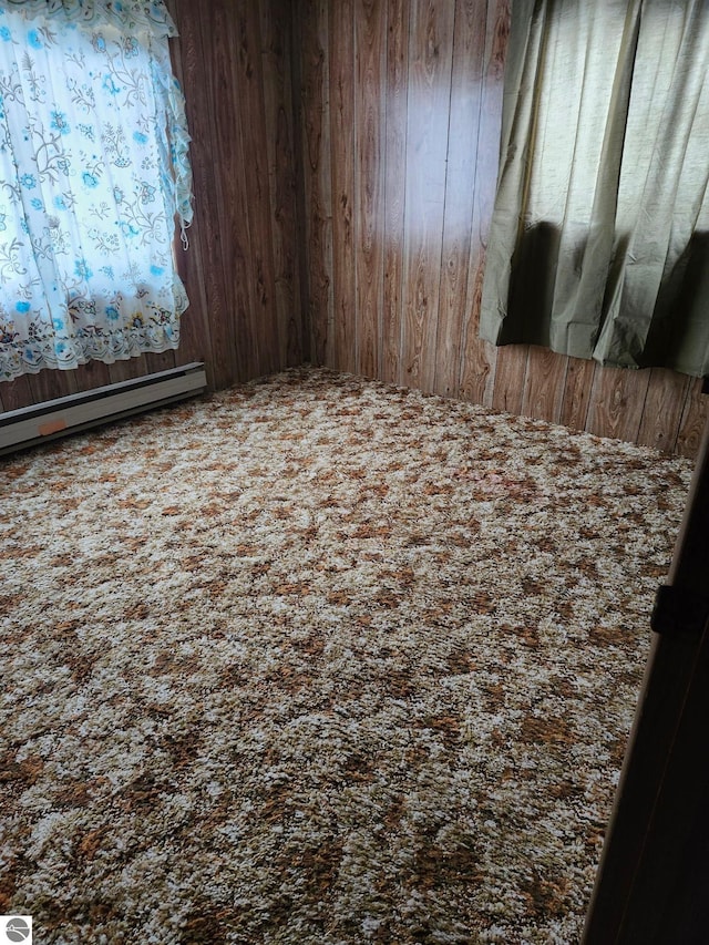 unfurnished room featuring a baseboard radiator