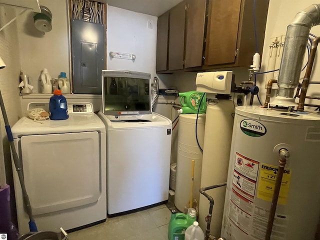 520 Fairlane, Alma, MI 48801 - clothes washing area featuring washing machine and clothes dryer, electric panel, gas water heater, cabinet space, and light tile patterned floors