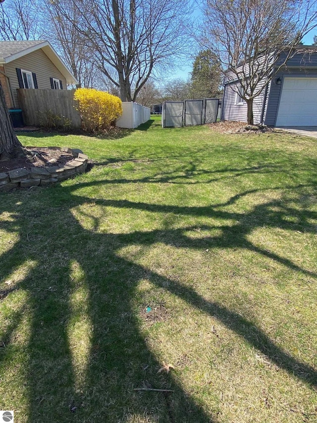 520 Fairlane, Alma, MI 48801 - view of yard featuring fence and a garage