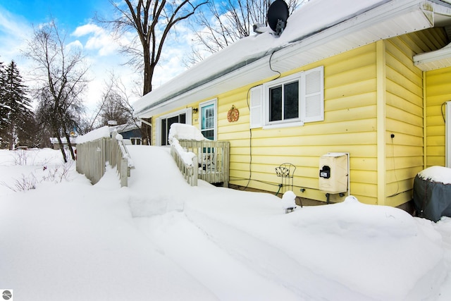 view of front of house featuring a garage and fence