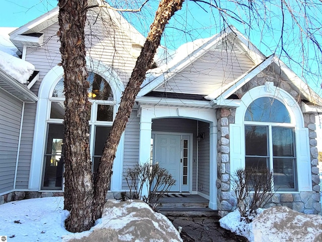 exterior space featuring stone siding