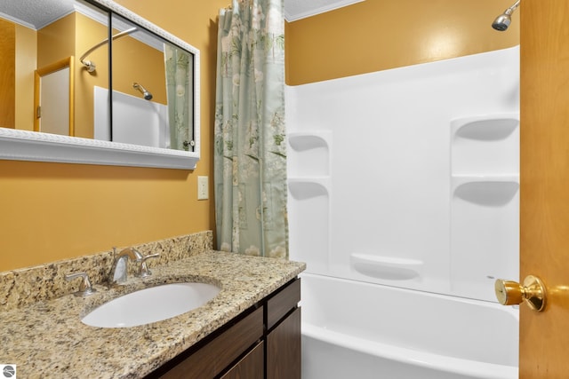 bathroom with shower / tub combo with curtain and vanity