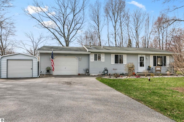 ranch-style home featuring a garage, a front lawn, and aphalt driveway