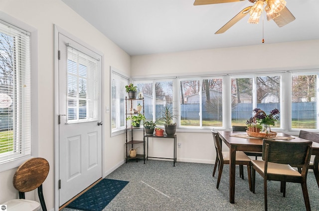 sunroom featuring a healthy amount of sunlight and ceiling fan