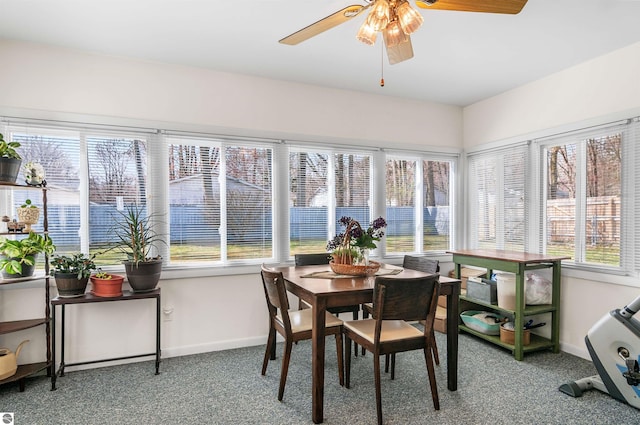 sunroom / solarium featuring ceiling fan