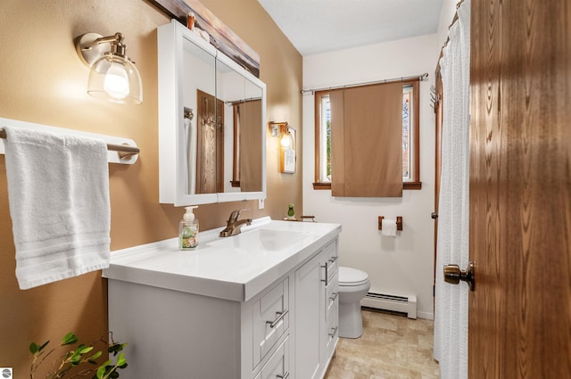 bathroom featuring a baseboard radiator, vanity, toilet, and baseboards