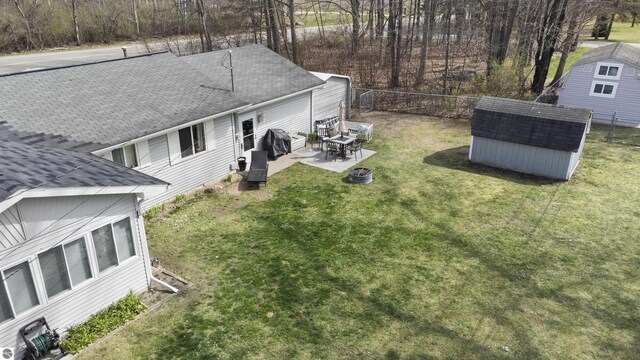 view of yard featuring a patio, a shed, an outdoor structure, and fence private yard