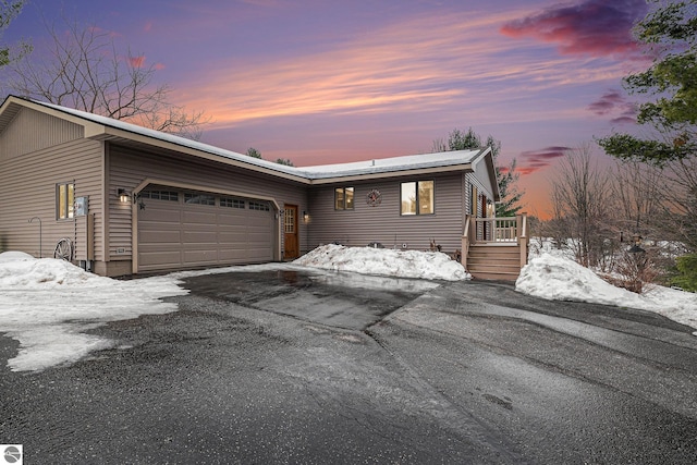 view of front of home featuring driveway and an attached garage