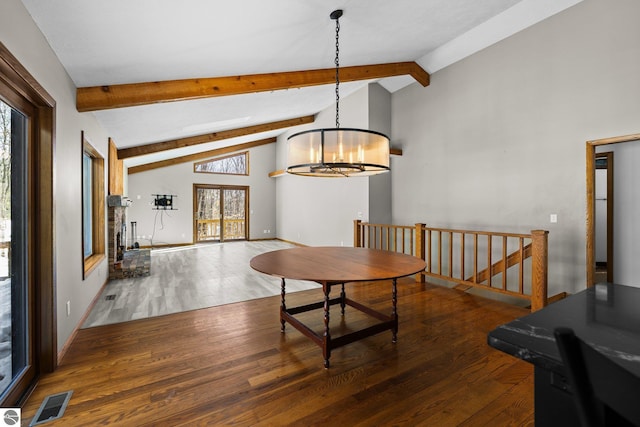 dining room with visible vents, baseboards, dark wood-style floors, beamed ceiling, and an inviting chandelier