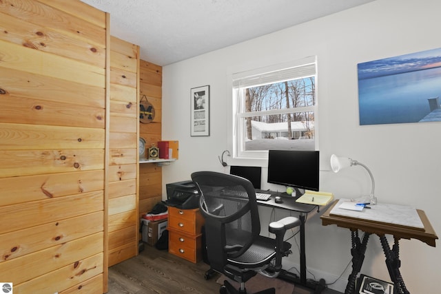 office space with a textured ceiling and dark wood finished floors