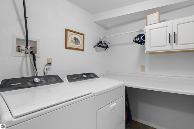 washroom featuring cabinet space and washing machine and dryer