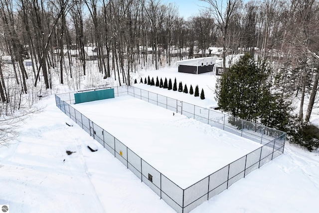 yard covered in snow with fence