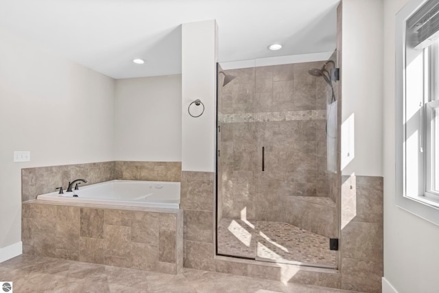 full bath featuring recessed lighting, a garden tub, and a shower stall