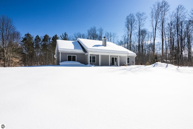 view of front of property featuring a chimney