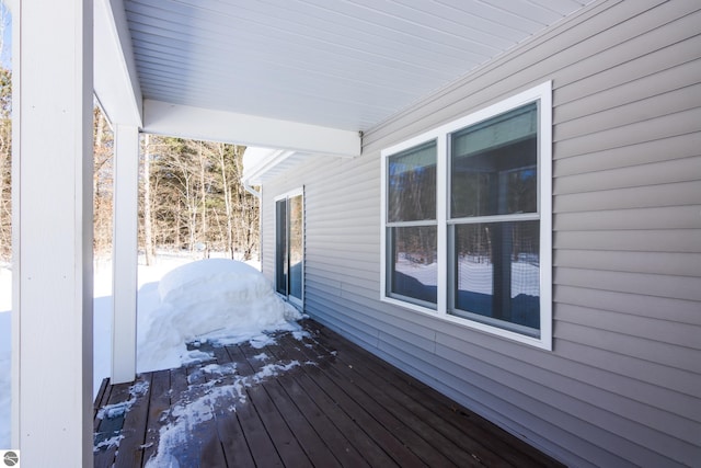 view of snow covered deck