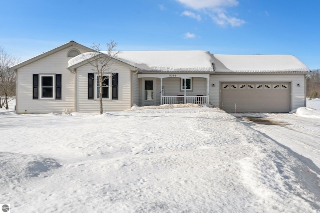 single story home featuring an attached garage and covered porch