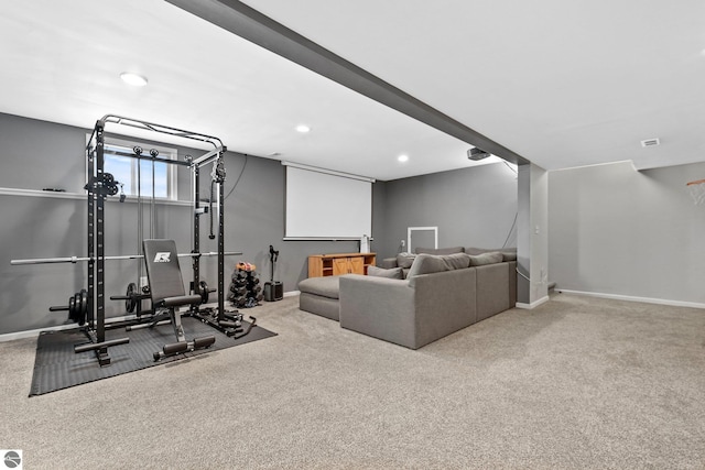 exercise area with light carpet, recessed lighting, and baseboards