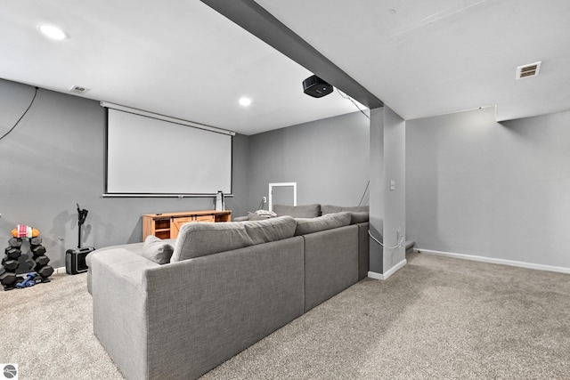 cinema room featuring recessed lighting, light colored carpet, visible vents, and baseboards