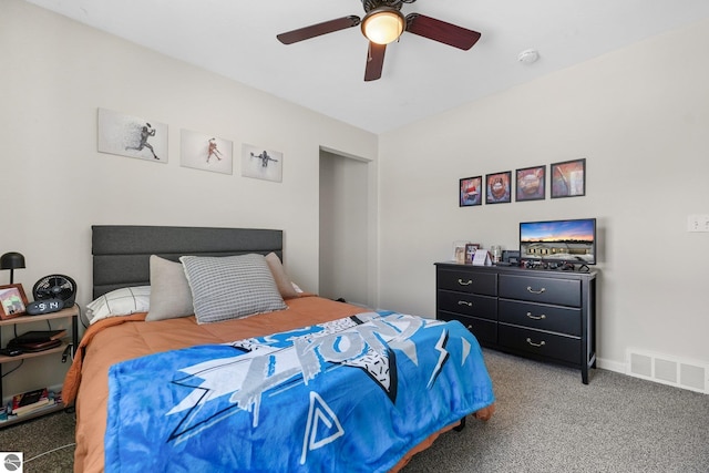 bedroom featuring a ceiling fan, baseboards, visible vents, and carpet flooring