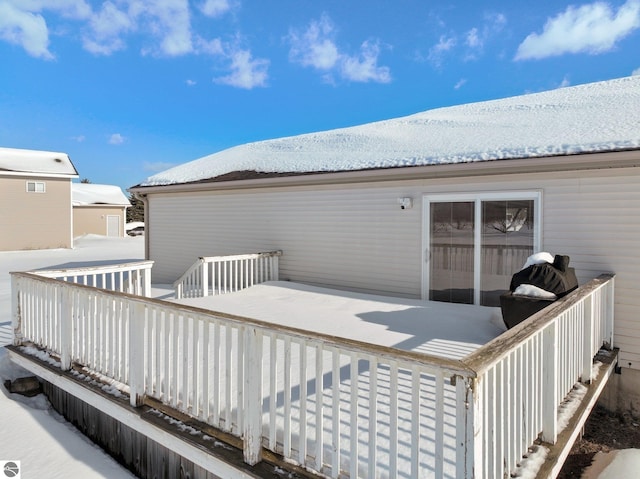 view of snow covered deck