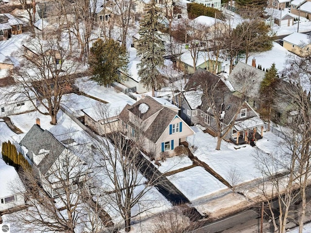 snowy aerial view with a residential view