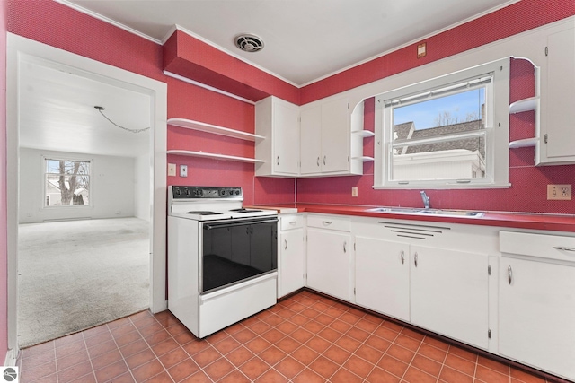kitchen featuring visible vents, white cabinetry, open shelves, and electric stove